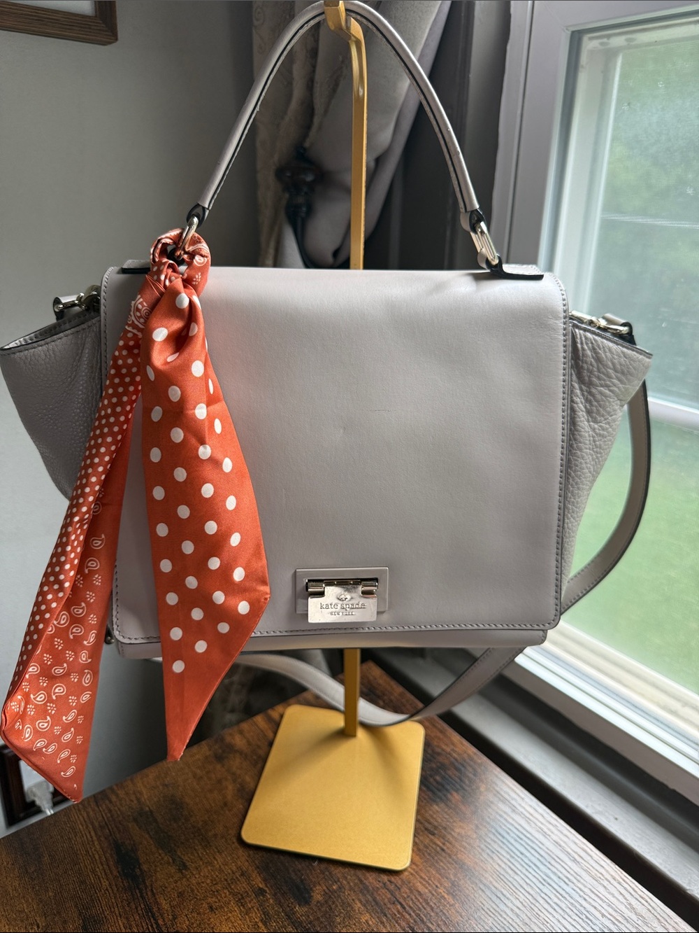kate spade light gray leather satchel with orange polka-dot scarf